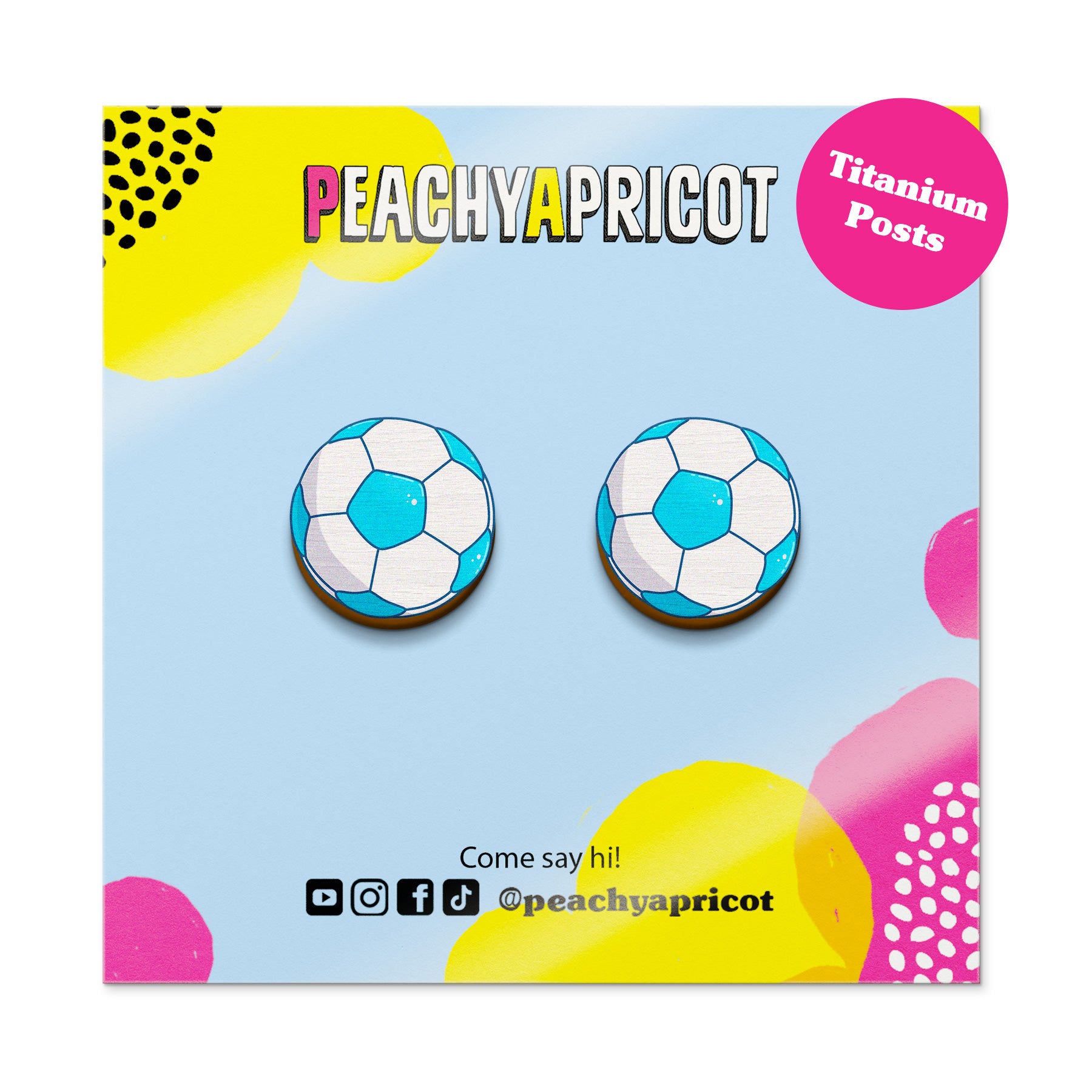 Soccer ball earrings on a colorful 'Peachy Apricot' branded card with social media handles.