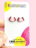 Axolotl Earrings on wood