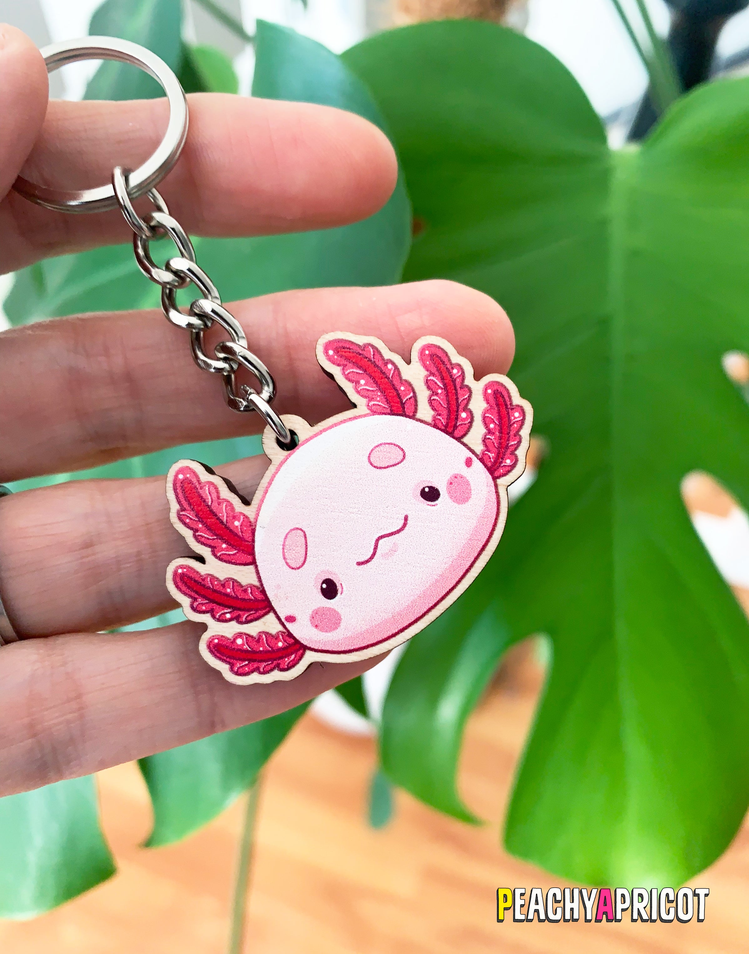 Cute axolotl Illustration printed on a wooden keychain