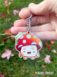 Cute Frog and mushroom illustration printed on a wooden keychain